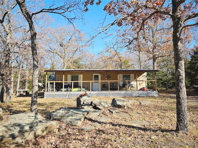 view of front facade featuring a sunroom