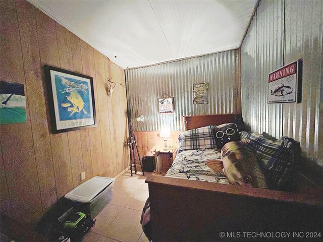 bedroom with wooden walls