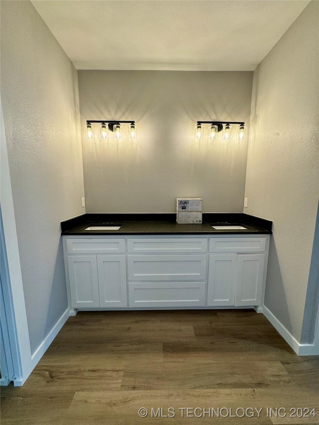 bathroom with wood-type flooring