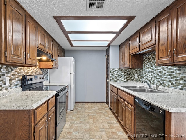 kitchen featuring sink, black dishwasher, a textured ceiling, stainless steel range with electric stovetop, and decorative backsplash