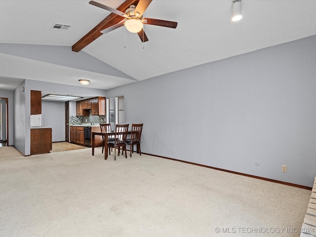 dining area with light carpet, ceiling fan, and lofted ceiling with beams