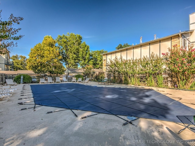 view of swimming pool featuring a patio