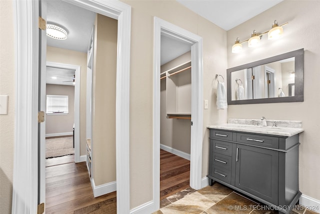 bathroom featuring vanity and hardwood / wood-style flooring