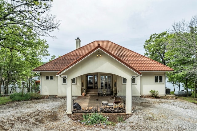 back of house with a porch and central air condition unit