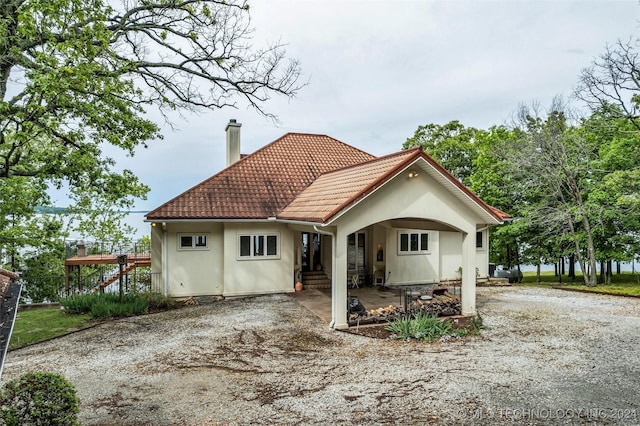 back of property featuring a patio area