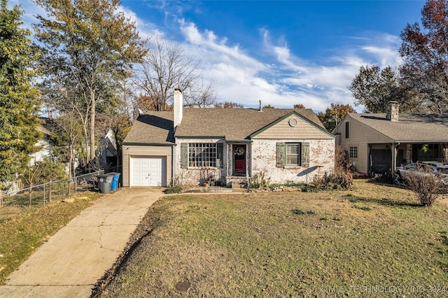 single story home featuring a front yard and a garage