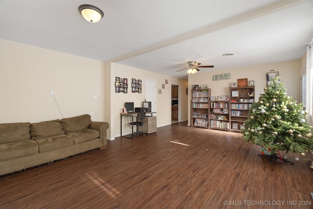 living room featuring ceiling fan and dark wood-type flooring