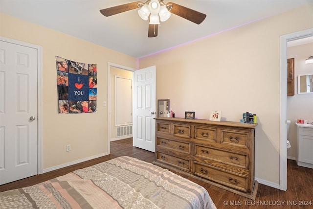 bedroom with connected bathroom, dark hardwood / wood-style floors, and ceiling fan