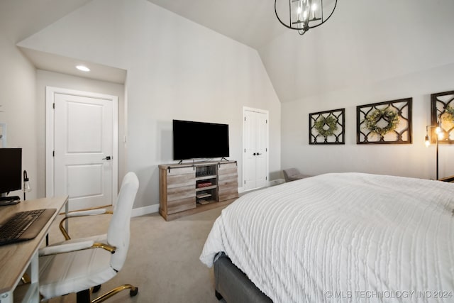 carpeted bedroom with a chandelier and vaulted ceiling