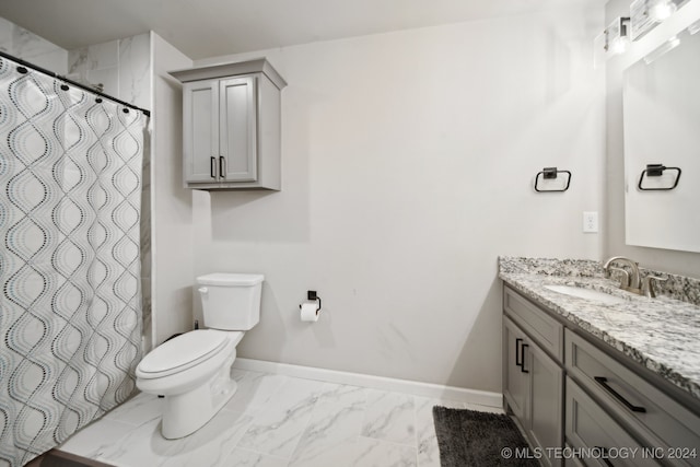 bathroom featuring vanity, curtained shower, and toilet