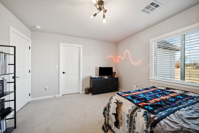 bedroom featuring light colored carpet