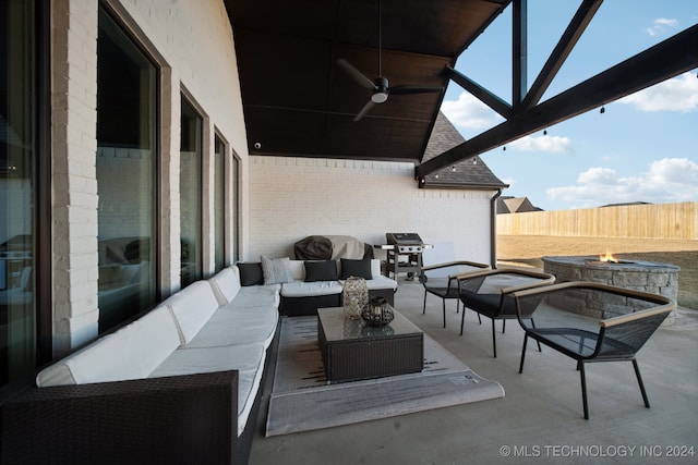 view of patio / terrace featuring ceiling fan, a grill, and an outdoor living space with a fire pit