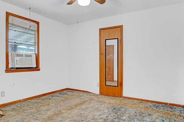 empty room with ceiling fan and cooling unit