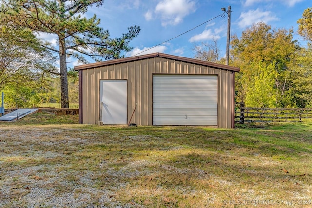 garage with a lawn