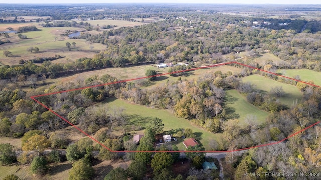 birds eye view of property with a rural view