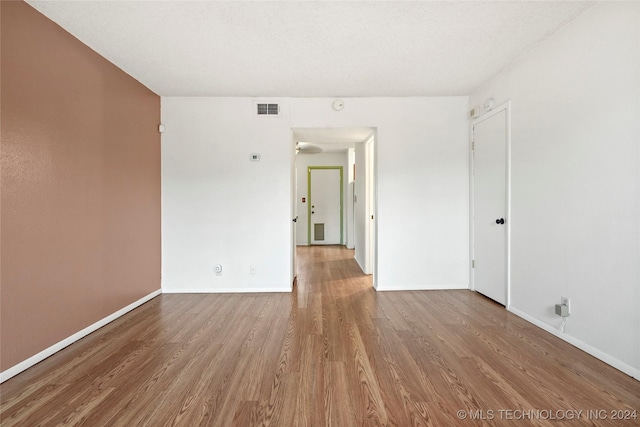 spare room featuring light hardwood / wood-style floors