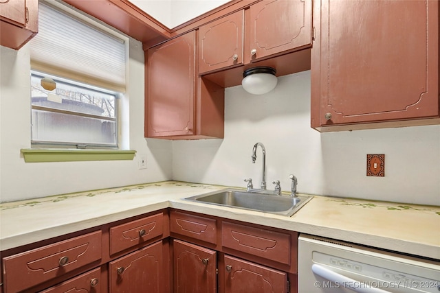 kitchen featuring sink and white dishwasher