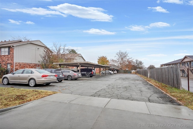 view of vehicle parking with a carport