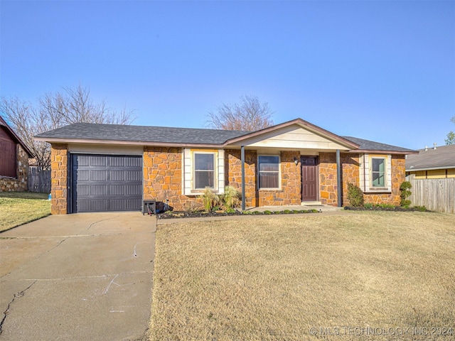 single story home with a garage and a front yard