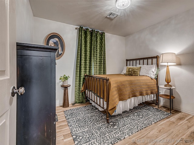 bedroom featuring wood-type flooring