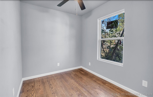 empty room with wood-type flooring and ceiling fan