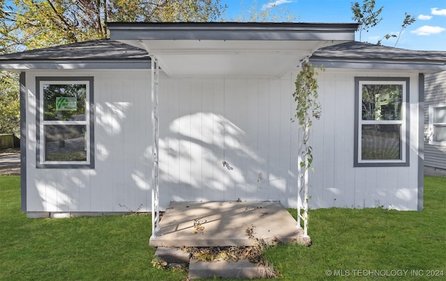 view of home's exterior featuring a lawn