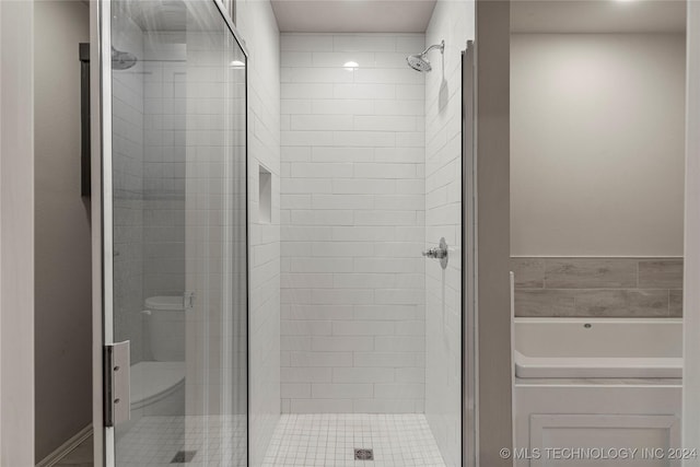 bathroom featuring plus walk in shower