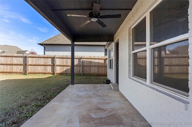 view of patio featuring ceiling fan