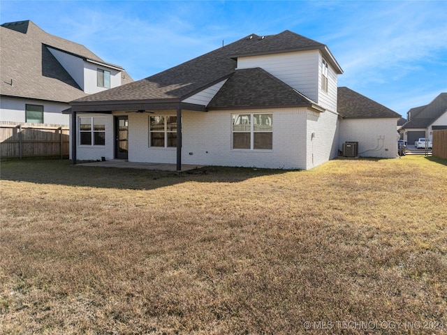 rear view of house featuring a lawn, ceiling fan, a patio, and central AC