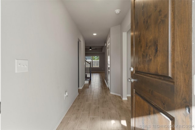 hallway with light hardwood / wood-style flooring