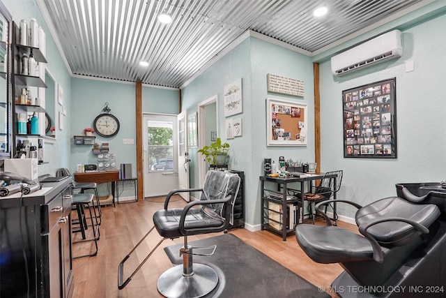 living area with light hardwood / wood-style floors, an AC wall unit, and ornamental molding