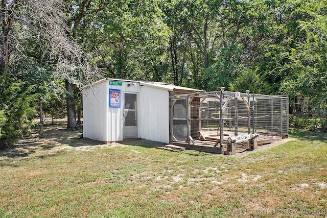 view of outdoor structure with a yard