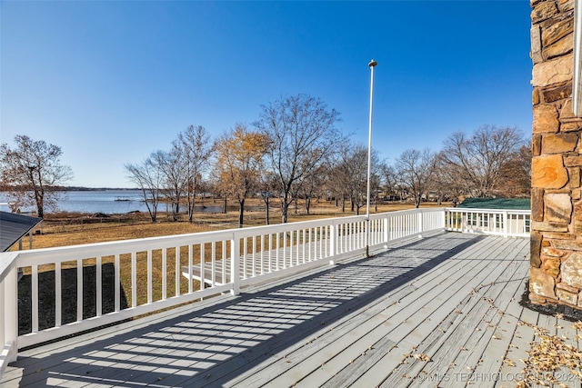 wooden deck featuring a water view