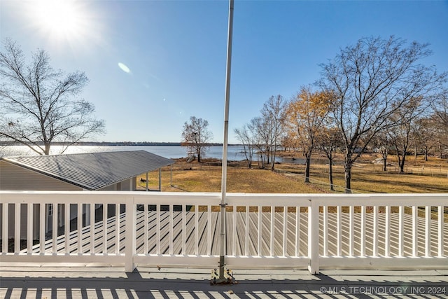 wooden deck with a water view