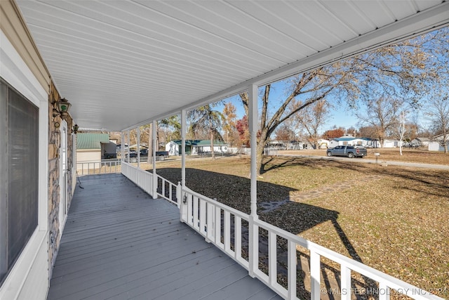 wooden terrace featuring a porch