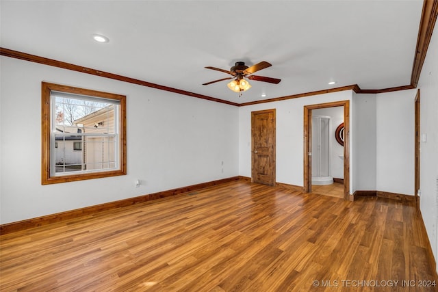 empty room featuring light hardwood / wood-style flooring, ceiling fan, and crown molding