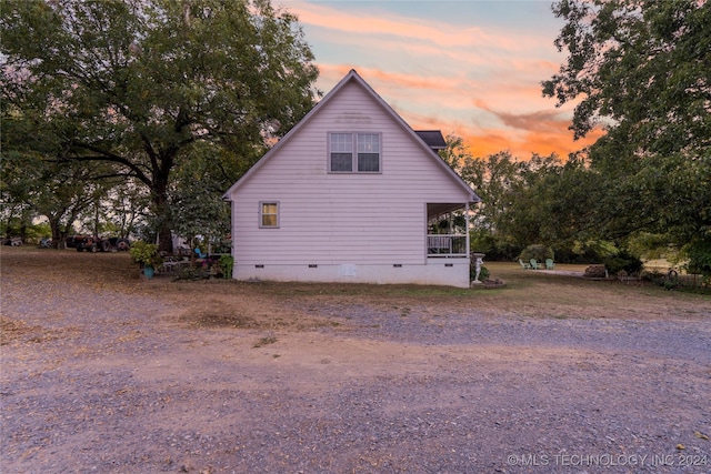 view of property exterior at dusk