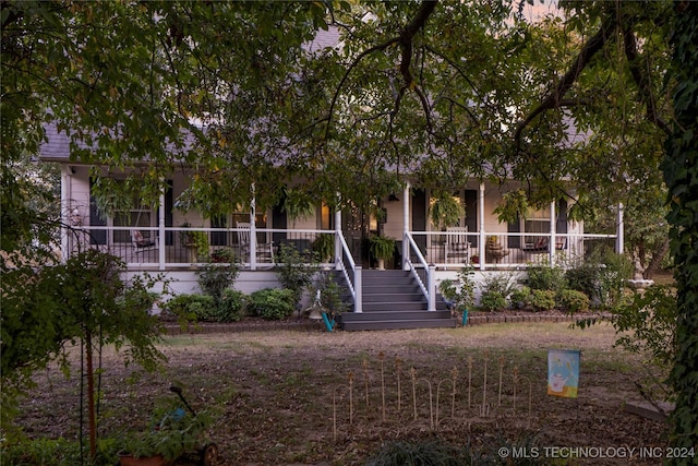 obstructed view of property featuring covered porch