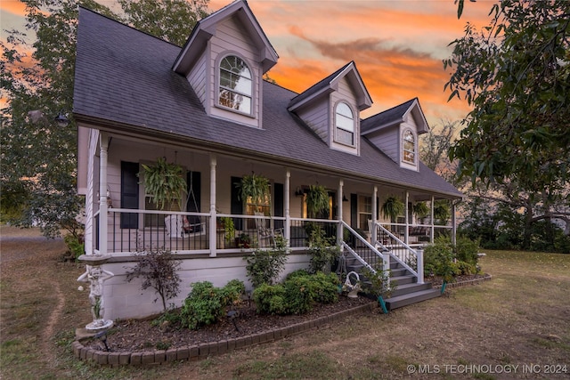 cape cod home with covered porch