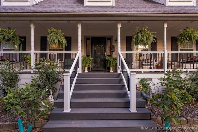 property entrance featuring a porch