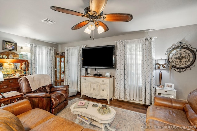 living room featuring a wealth of natural light, ceiling fan, and hardwood / wood-style flooring