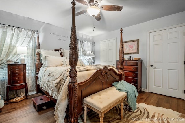 bedroom with wood-type flooring and ceiling fan