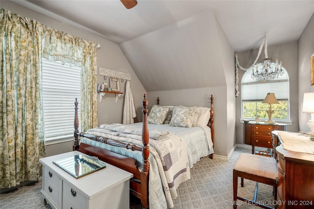 carpeted bedroom with vaulted ceiling and ceiling fan