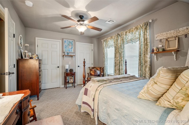 bedroom with ceiling fan and light colored carpet