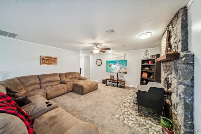 living room with ceiling fan, a textured ceiling, visible vents, and carpet flooring