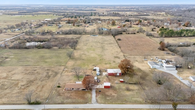 birds eye view of property featuring a rural view