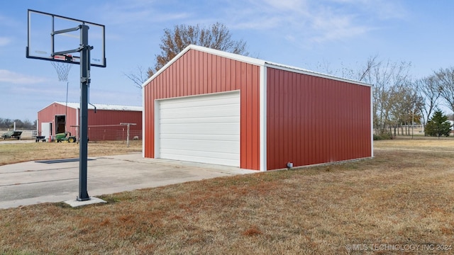 detached garage featuring driveway