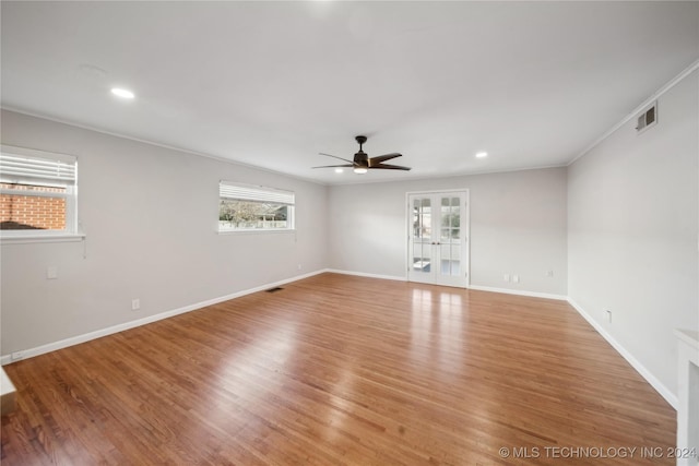 empty room with light hardwood / wood-style flooring, ceiling fan, and ornamental molding