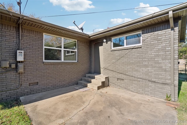 doorway to property featuring a patio