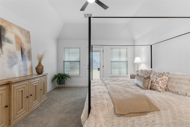 bedroom featuring multiple windows, ceiling fan, light carpet, and vaulted ceiling